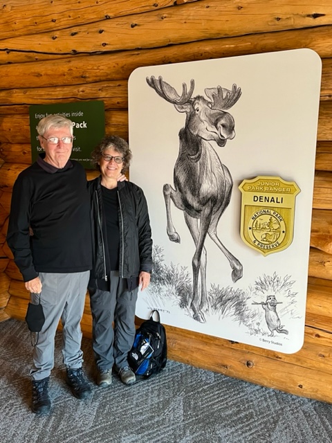 John and Susan at Denali Visitors' Center Moose cartoon