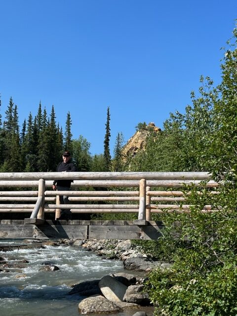 John on bridge over Riley Creek