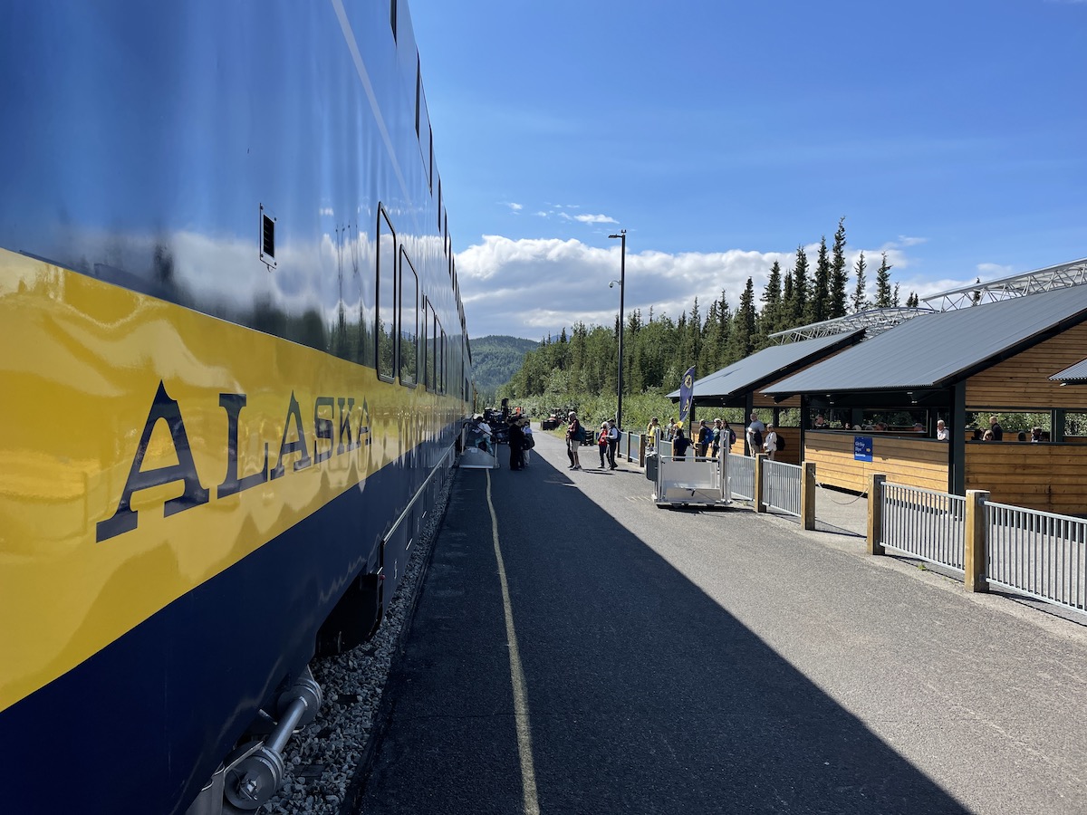 Long shot of group boarding the Alaska train to Talkeetna