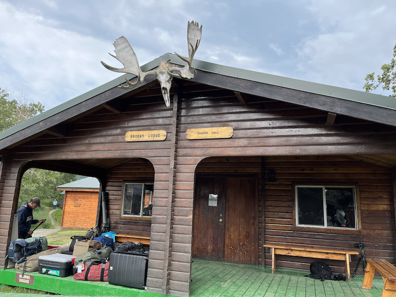 Outside the dining Hall at Katmai National Park with luggage on the porch