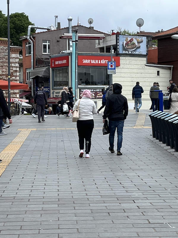 Restaurant for lunch with people walking towards it