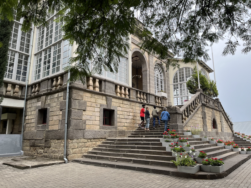 Corbin family taking stairs to historical building at Unity Park in Addis Ababa, Ethiopia.