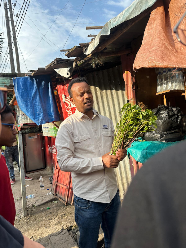 Melaku with Khat in marketplace across from the hotel in Addis Ababa, Ethiopia